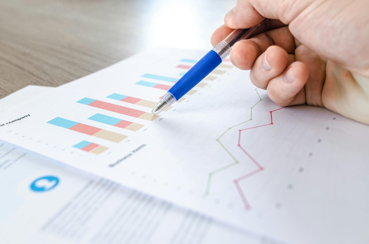 looking at data charts on printed paper